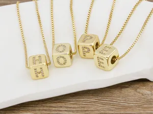 Gold plated cubic zirconia cube letter pendant necklace detail shot showing HOPE letters.