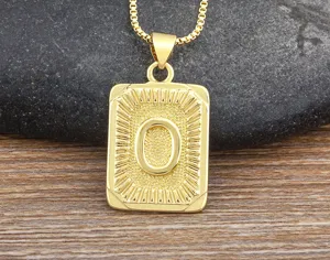 Close-up of the gold-plated stainless steel letter O pendant, highlighting rectangle details.