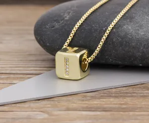 Detailed view of the gold-plated cubic necklace featuring a sparkly zirconia letter pendant.