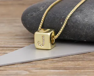 Gold plated cubic zirconia letter J cube pendant necklace delicate fine jewelry detail shot