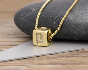 Gold plated cube letter B pendant necklace with sparkling cubic zirconia stones for women.