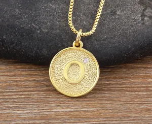 Gold letter O pendant necklace with sparkling zircon, elegant copper 18k fashion jewelry detail.