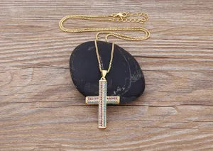 Gold-plated colorful zircon cross pendant necklace closeup, fashion clavicle chain detail.
