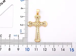 Detailed view of the exquisite gold-plated cross pendant sparkling with colorful zircons.