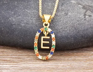 Gold-plated necklace featuring a colorful cubic zirconia oval pendant with letter E detail.