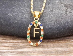Gold-plated colorful zircon letter F pendant necklace detail, sparkling multi-color stones.