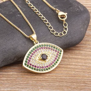 Vintage evil eye pendant necklace with colorful cubic zirconia and gold chain design.