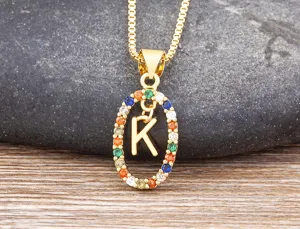 Detailed close-up shot of the gold-plated colorful cubic zirconia letter K necklace.