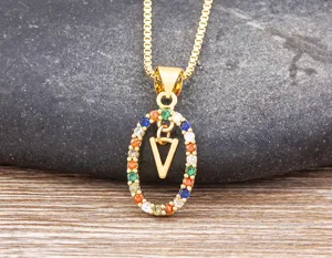 Exquisite gold-plated necklace featuring a colorful zirconia oval pendant with letter V charm.