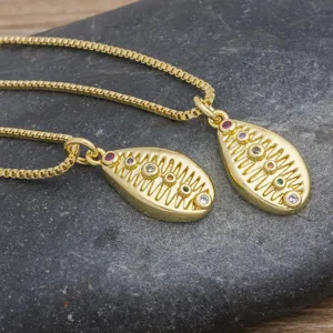 Gold-plated copper shell pendant necklace with colorful cubic zirconia stones for women beach style.