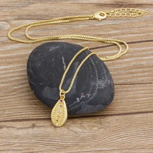 Gold tone box chain necklace featuring a teardrop pendant with colorful cubic zirconia.