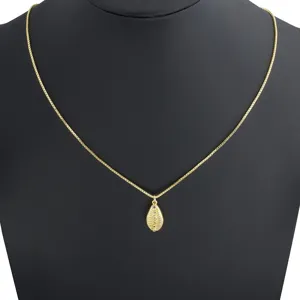 Gold-tone chain necklace featuring a delicate teardrop zircon pendant, ideal for beach.