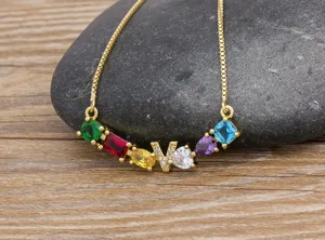 Gold plated multi-color cubic zirconia gemstone alphabet V pendant necklace for women daily wear.