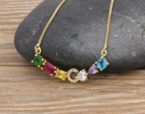 Detailed view of the colorful gemstone initial C pendant necklace, gold-plated dainty chain.