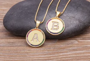 Gold tone rhinestone letter pendant necklace set featuring crystal alphabet charms on delicate chains.
