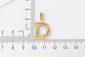Colorful rhinestone letter D pendant necklace detail for hip hop fashion style.