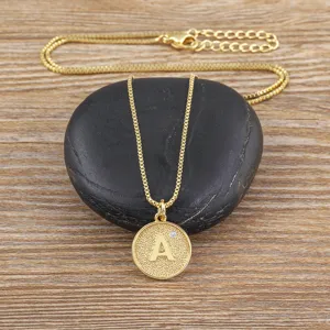 Minimalist 18K gold plated copper initial letter A pendant necklace with cubic zirconia.