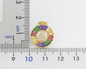 Detailed close-up shot of the colorful crystal letter A earring with measurement scale.
