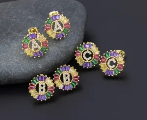 Colorful baguette crystal letter earrings detail view with sparkling zirconia gold.