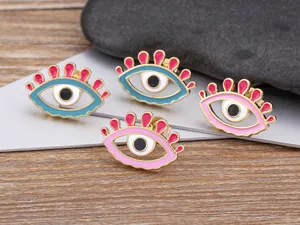 Detailed view of colorful evil eye enamel stud earrings with 18k gold plated copper finish.