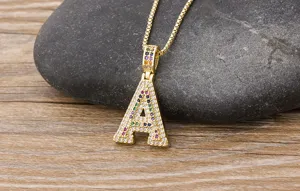 Gold-plated colorful cubic zirconia letter A pendant necklace detailed close-up display view.