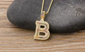 Detailed shot of a stylish gold-plated colorful zircon letter B pendant necklace for fashion.