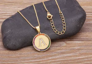 Gold initial letter A pendant necklace with colorful cubic zirconia border and dainty chain.