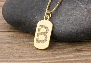 Close-up detail of the gold-plated letter B pendant necklace sparkling with cubic zirconia stones.