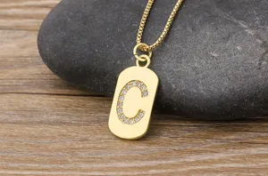 Close-up of gold-plated initial letter C pendant necklace with sparkling cubic zirconia.