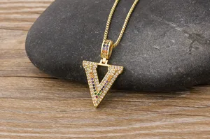 Detailed shot of a stylish gold-plated micro-paved multi-color zircon letter V pendant necklace.