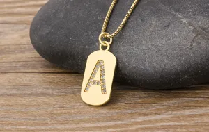 Detailed shot of gold letter A pendant necklace showcasing cubic zirconia inlay and box chain.
