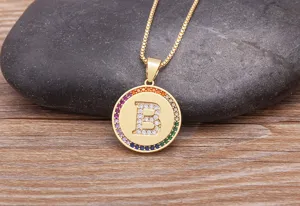 Gold initial letter B pendant necklace with colorful pavé cubic zirconia round charm for women.