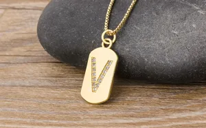 Gold 18k plated brass letter V pendant necklace with sparkling cubic zirconia stones.