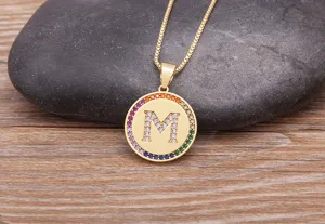 Gold-plated brass micro-pave multi-color cubic zirconia letter M pendant necklace detail view.