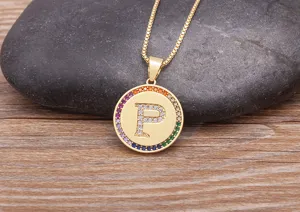 Gold plated alphabet P pendant necklace with colorful cubic zirconia stones, elegant jewelry detail.