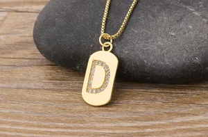 Detailed close-up of a gold-plated letter D initial pendant necklace with sparkling zirconia.