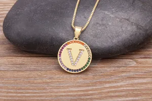 Gold-plated brass initial V pendant necklace featuring colorful cubic zirconia pave border detail.