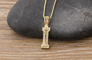Detailed close-up view of the gold letter I pendant necklace featuring colorful cubic zirconia.