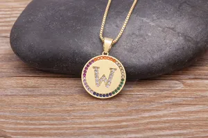 Gold-plated brass initial letter W pendant necklace with colorful cubic zirconia stones.