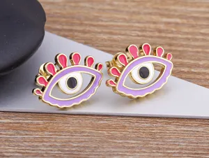 Detailed view of fashionable 18k gold plated enamel evil eye stud earrings, chic design.