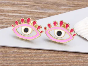 Detailed close-up view of creative evil eye enamel stud earrings in 18k gold plated copper.