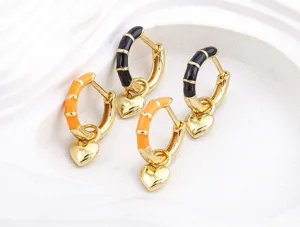 Gold-plated enamel heart hoop earrings for women, trendy sweet and cool style jewelry detail.