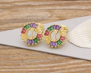 Detailed view of colorful crystal zircon letter I stud earrings, gold plated fashion jewelry.