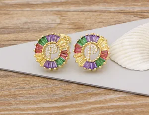 Gold plated colorful crystal letter P stud earrings detail view, sparkling fashion jewelry.