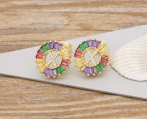 Gold-plated copper letter X stud earrings with colorful baguette crystals and sparkling zircons.