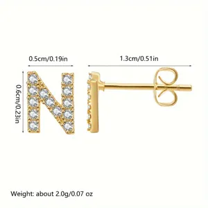 Gold initial N stud earrings with clear cubic zirconia, stainless steel post detail view.