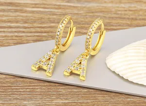 Gold plated letter A hoop earrings featuring sparkling micro pave cubic zirconia detail view