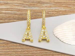 Close-up detail of gold-plated letter A cubic zirconia hoop earrings pendant showcasing craftsmanship.