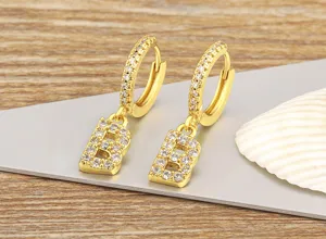 Gold plated letter B hoop earrings with sparkling cubic zirconia pavé, elegant initial jewelry.