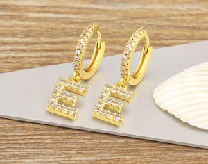 Exquisite 18k gold plated copper pave cubic zirconia letter E hoop earrings detail showcase.